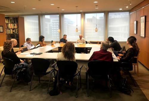 Judaic Studies researchers and students gathered at a table