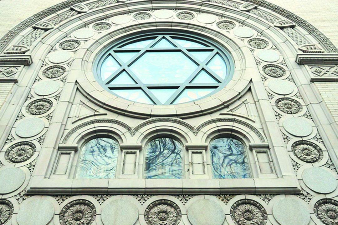 Image of the outside of a synagogue with a large star of David